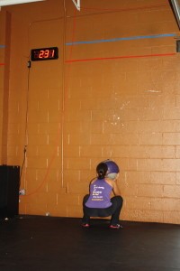 squat low for wall balls